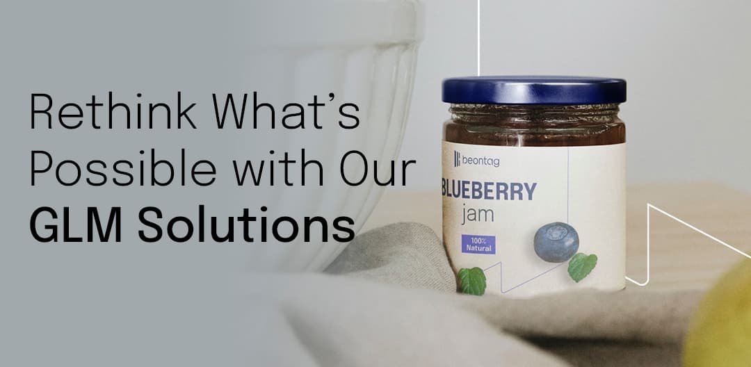 Banner image with the text “Rethink What’s Possible with Our GLM Solutions” next to a blueberry jam jar label on a kitchen counter.